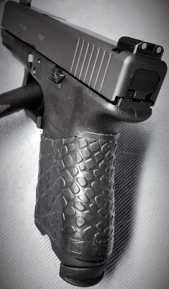 Glock 19 (angled view) with trimmed TUFF1 Black Boa