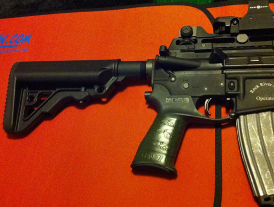 Close-up Rock River LAR15 Operator with TUFF1 Death Grip OD Green (on Stark pistol grip) & Zombie Down! on the Tapco fore grip, Sightmark optics, Magpulmoe BAD lever, and a laser etched dust over