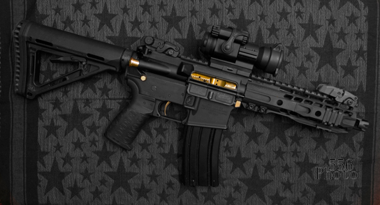 This is B.P.'s PDW AR with TUFF1 Black Death Grip Strike Industries check mate muzzle brake Strike Industries gold push pins Strike Industries gold Forward asset Strike Industries Enhanced pistol grip with TUFF1 grip cover Cryptic gold bolt carrier group SLR Rifle works Solo handguard Aim point PRO Magpul flip up sights Magpul MOE Stock American Trigger Corp gold trigger 7.5inch barrel