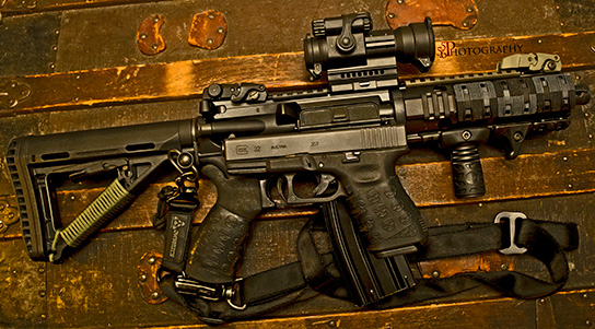 A pair of Black TUFF1 Death Grips on a AR-15 SBR and a Glock 32